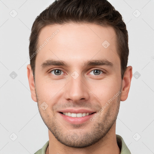 Joyful white young-adult male with short  brown hair and brown eyes