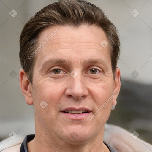 Joyful white adult male with short  brown hair and grey eyes