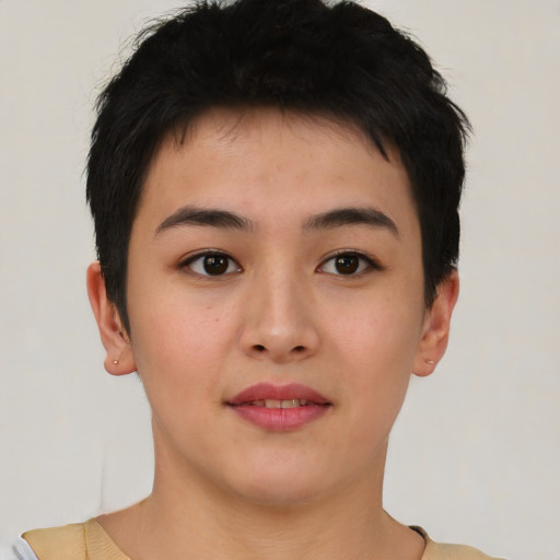 Joyful asian young-adult female with short  brown hair and brown eyes