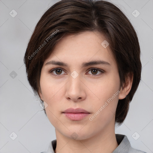 Neutral white young-adult female with medium  brown hair and brown eyes