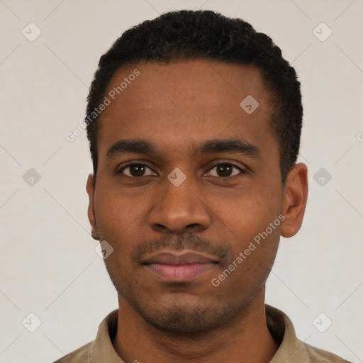 Neutral latino young-adult male with short  black hair and brown eyes
