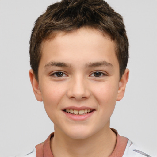 Joyful white child male with short  brown hair and brown eyes