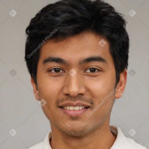 Joyful latino young-adult male with short  black hair and brown eyes