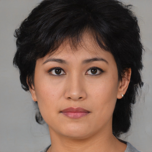 Neutral asian young-adult female with medium  brown hair and brown eyes