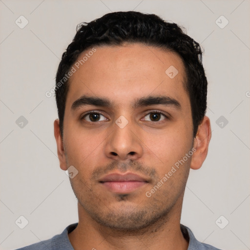 Neutral latino young-adult male with short  black hair and brown eyes