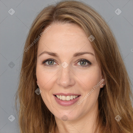 Joyful white adult female with long  brown hair and brown eyes