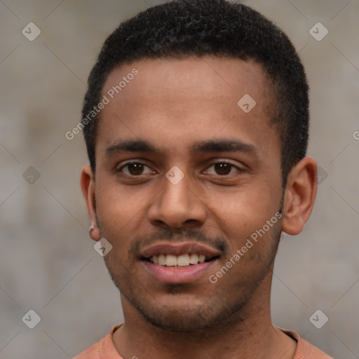 Joyful black young-adult male with short  brown hair and brown eyes