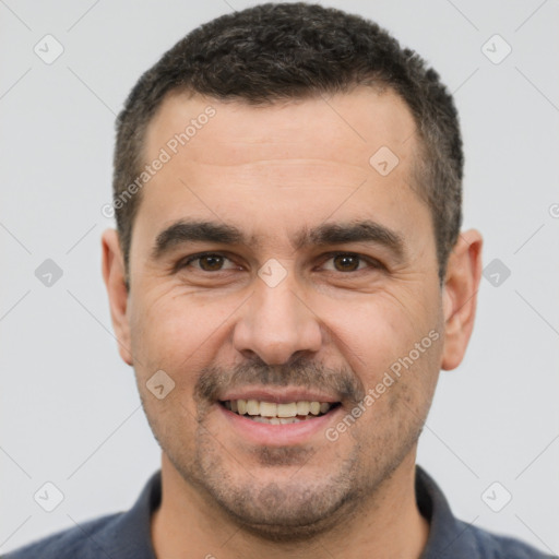 Joyful white adult male with short  brown hair and brown eyes