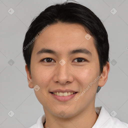 Joyful asian young-adult male with short  brown hair and brown eyes