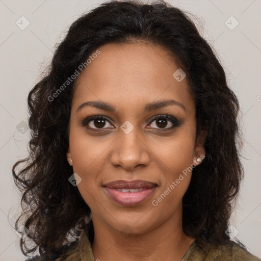 Joyful black young-adult female with long  brown hair and brown eyes