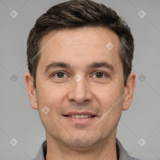 Joyful white adult male with short  brown hair and brown eyes