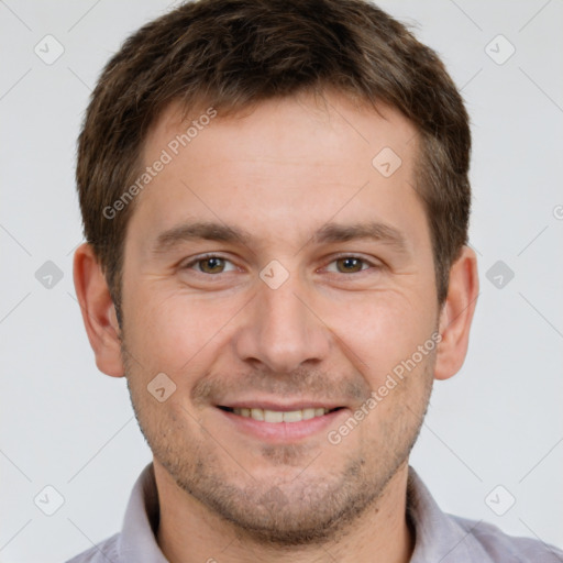 Joyful white young-adult male with short  brown hair and brown eyes