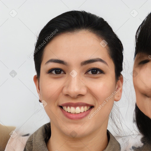 Joyful asian young-adult female with medium  black hair and brown eyes