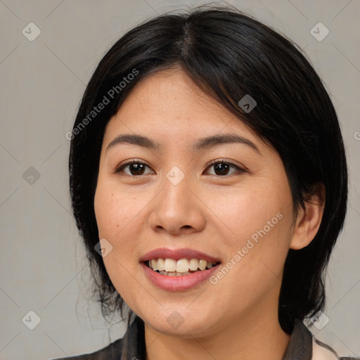 Joyful asian young-adult female with medium  black hair and brown eyes