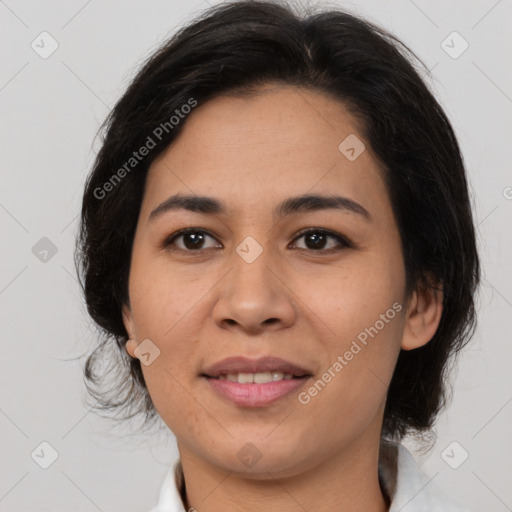 Joyful latino young-adult female with medium  brown hair and brown eyes