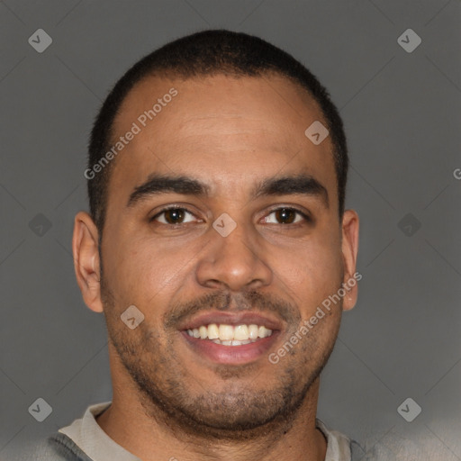 Joyful black young-adult male with short  brown hair and brown eyes