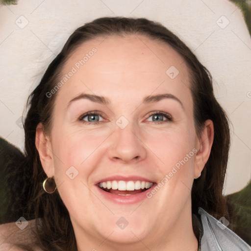 Joyful white adult female with long  brown hair and brown eyes