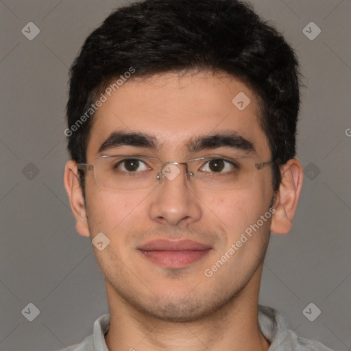 Joyful latino young-adult male with short  brown hair and brown eyes