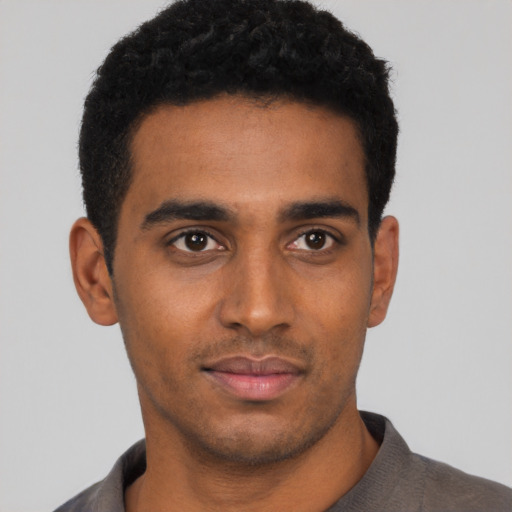 Neutral black young-adult male with short  black hair and brown eyes