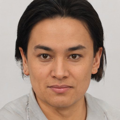Joyful asian adult male with short  brown hair and brown eyes