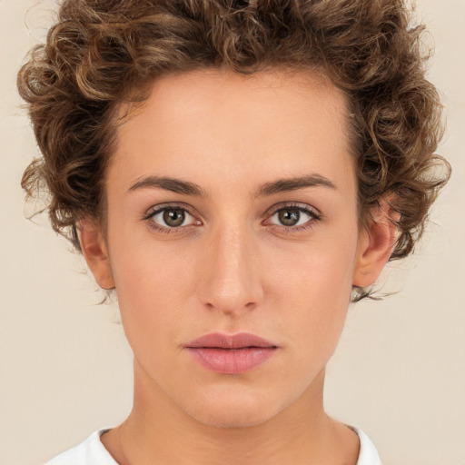 Neutral white young-adult female with short  brown hair and brown eyes