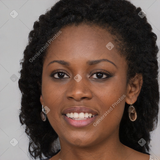 Joyful black young-adult female with long  brown hair and brown eyes