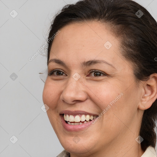 Joyful white adult female with medium  brown hair and brown eyes