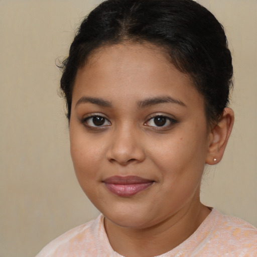 Joyful latino young-adult female with short  brown hair and brown eyes