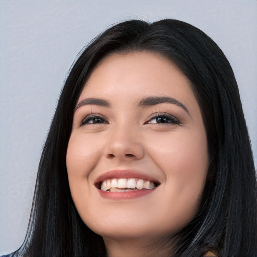 Joyful white young-adult female with long  black hair and brown eyes