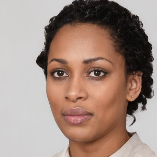 Neutral black young-adult female with short  black hair and brown eyes