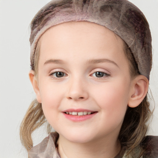 Joyful white child female with medium  brown hair and grey eyes