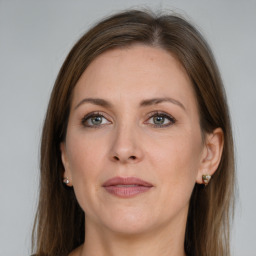 Joyful white adult female with long  brown hair and grey eyes