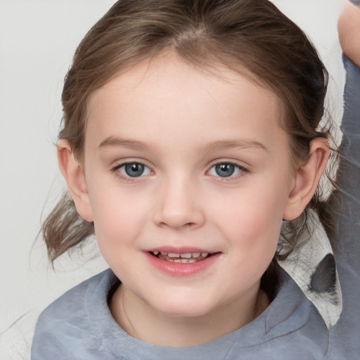 Joyful white child female with medium  brown hair and blue eyes