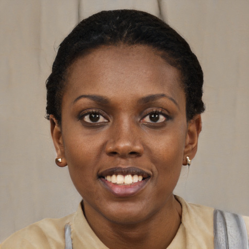 Joyful black young-adult female with short  black hair and brown eyes