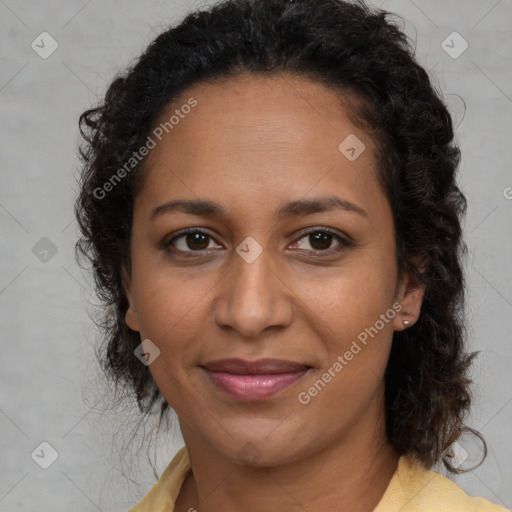 Joyful black adult female with medium  brown hair and brown eyes