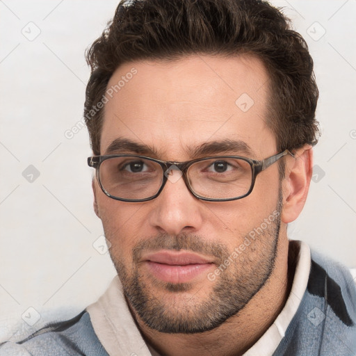 Neutral white young-adult male with short  brown hair and brown eyes