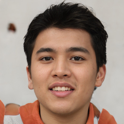Joyful asian young-adult male with short  brown hair and brown eyes