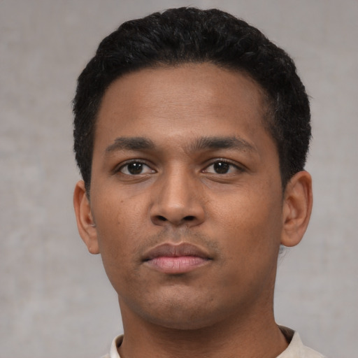 Neutral black young-adult male with short  black hair and brown eyes