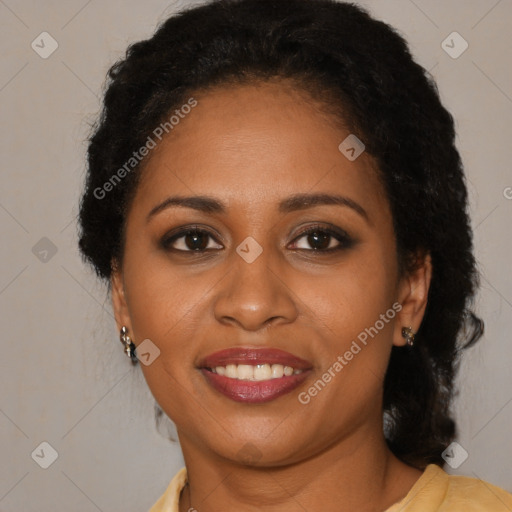 Joyful black young-adult female with long  brown hair and brown eyes