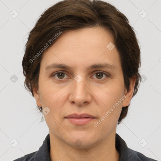 Joyful white adult female with short  brown hair and brown eyes