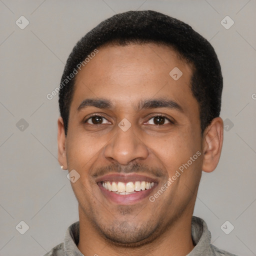 Joyful latino young-adult male with short  brown hair and brown eyes