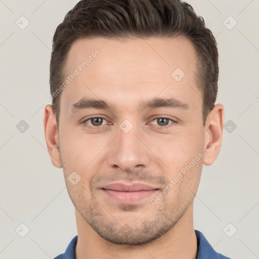 Joyful white young-adult male with short  brown hair and brown eyes