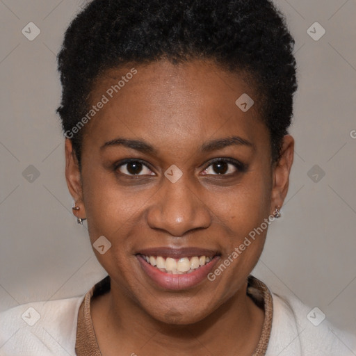 Joyful black young-adult female with short  brown hair and brown eyes