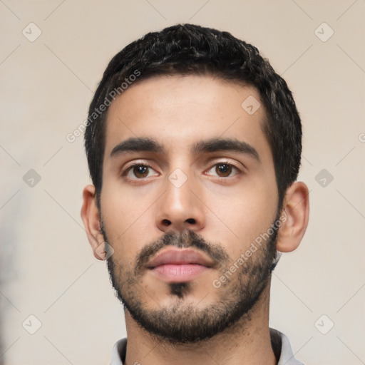 Neutral latino young-adult male with short  black hair and brown eyes