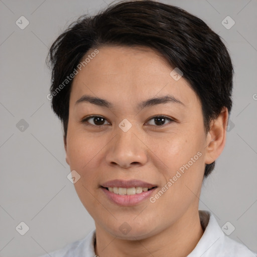 Joyful white adult female with medium  brown hair and brown eyes