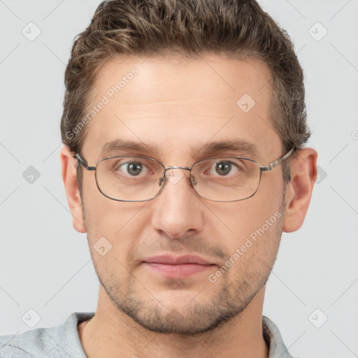 Joyful white adult male with short  brown hair and grey eyes