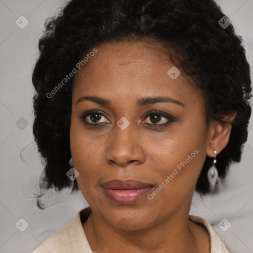 Joyful black adult female with medium  brown hair and brown eyes