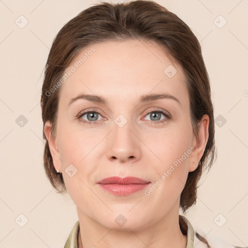 Joyful white adult female with medium  brown hair and grey eyes