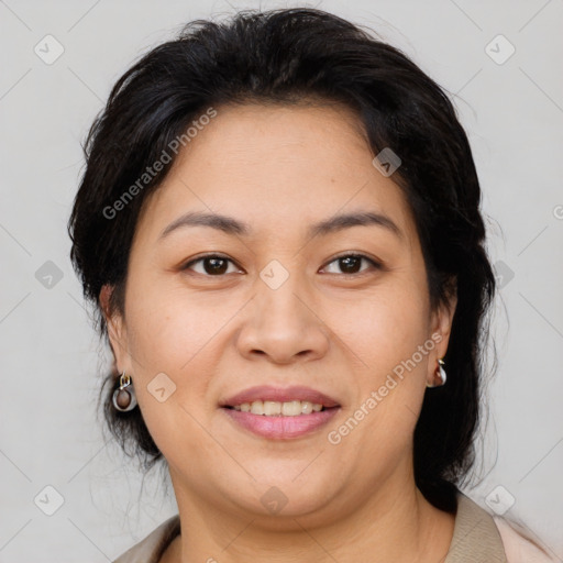 Joyful asian adult female with medium  brown hair and brown eyes