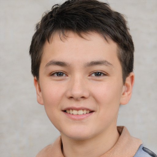 Joyful white child male with short  brown hair and brown eyes